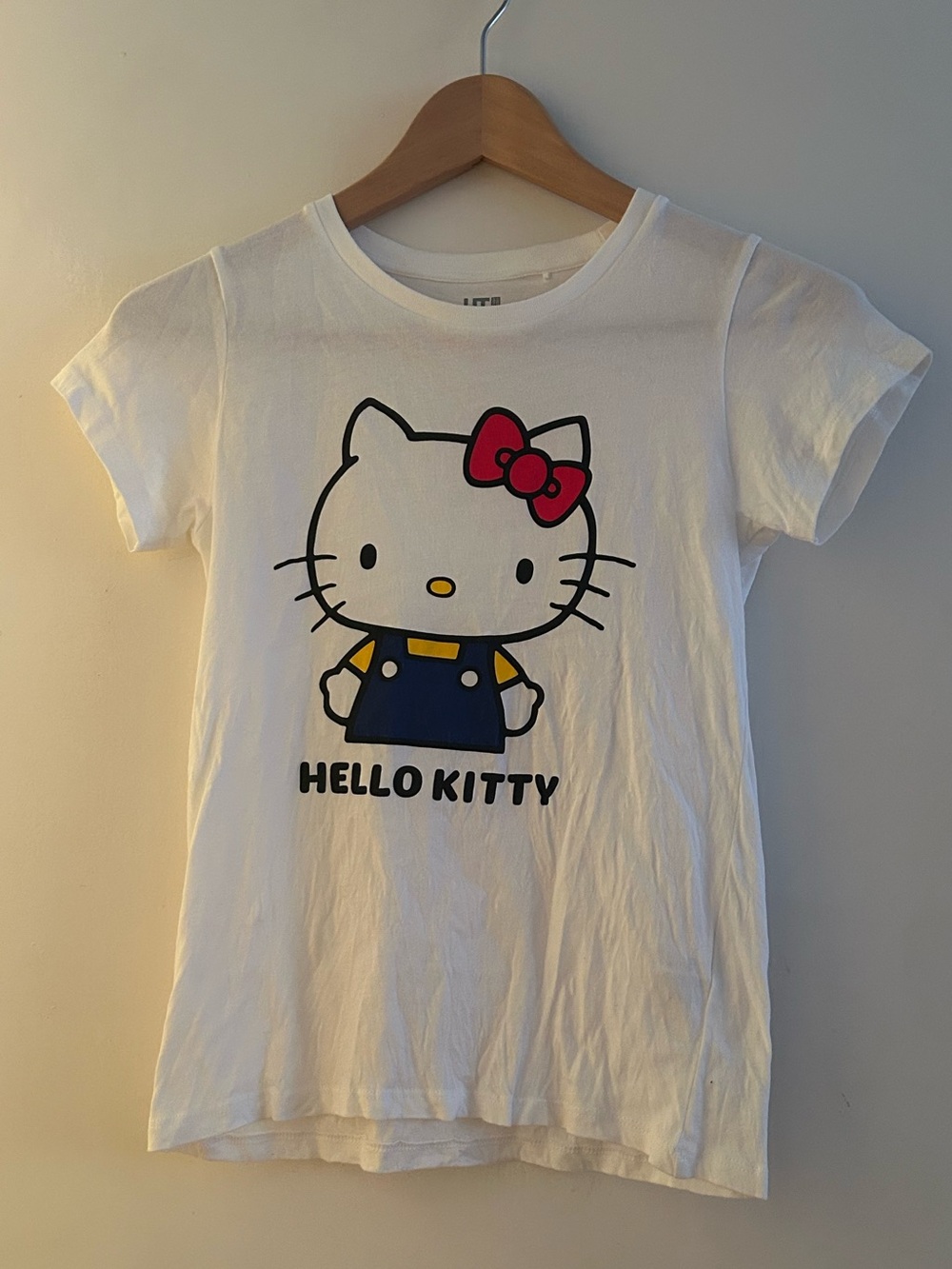 Uniqlo Sanrio Hello Kitty White Tee with Pink Bow and Navy Outfit
